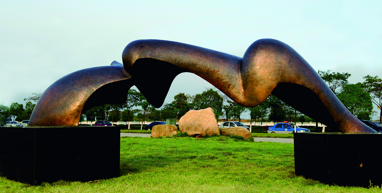 Front view of the undulating bronze form of Bridge of Winds.
