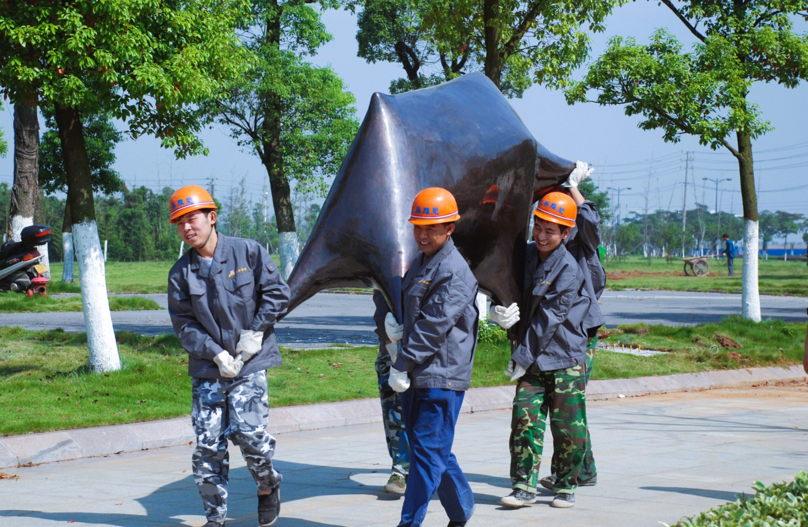 Team members moving Bull during installation.