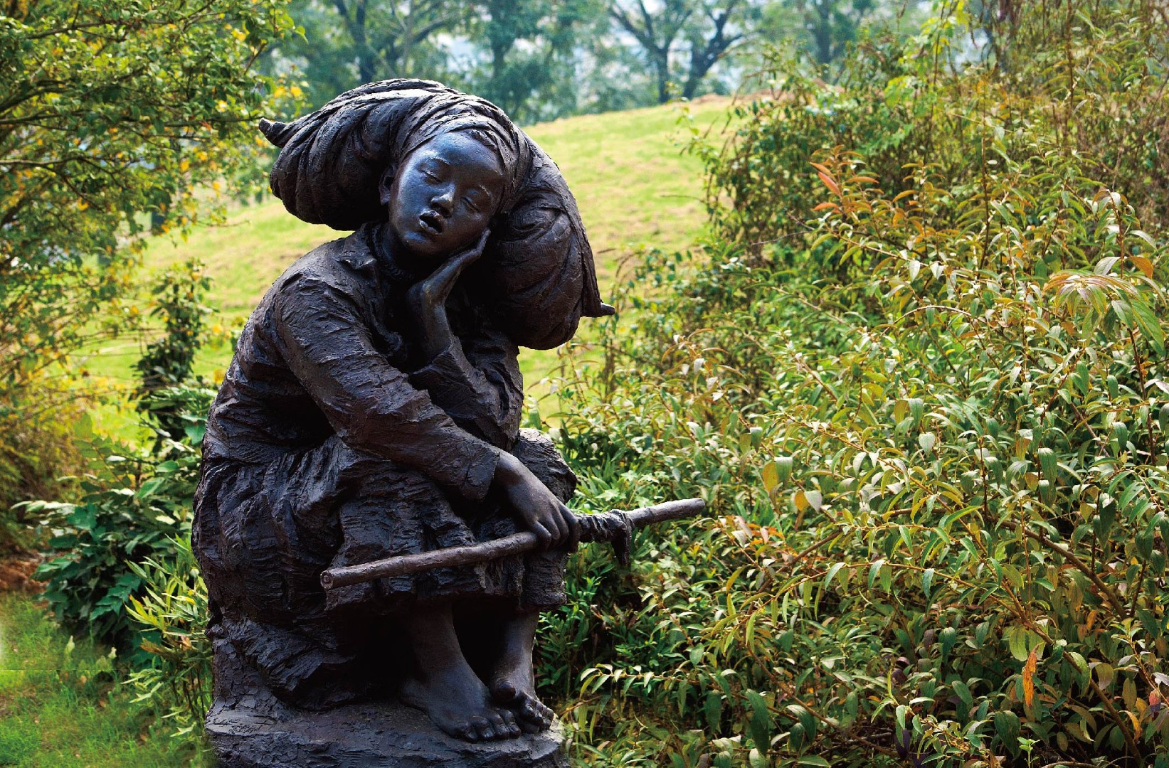 In the Sunshine by Hu Xuefu, a seated girl against green foliage.