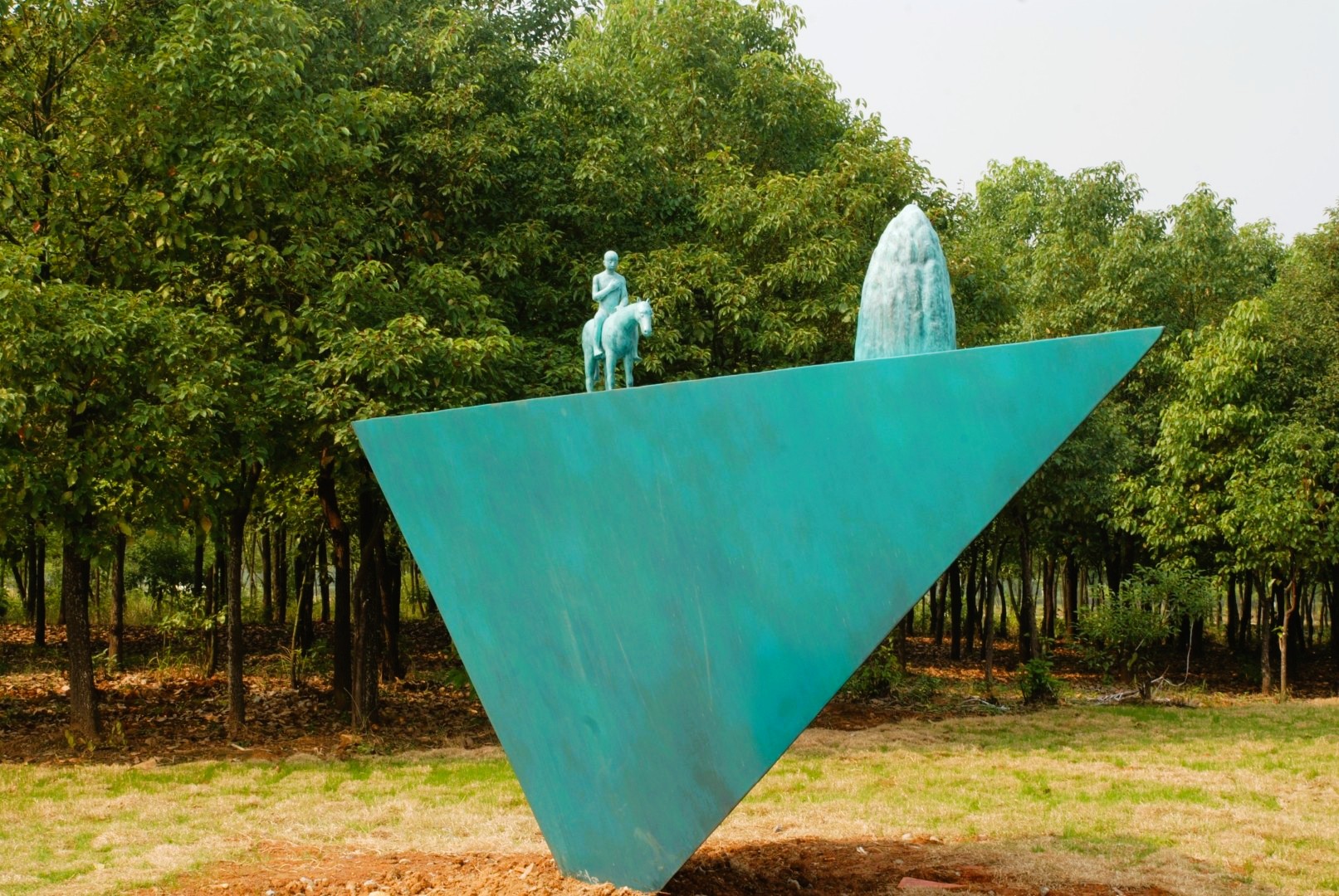 Take Dreams as Horse by Yang Yueqiang, with a rider and stone-like form on a triangular base.