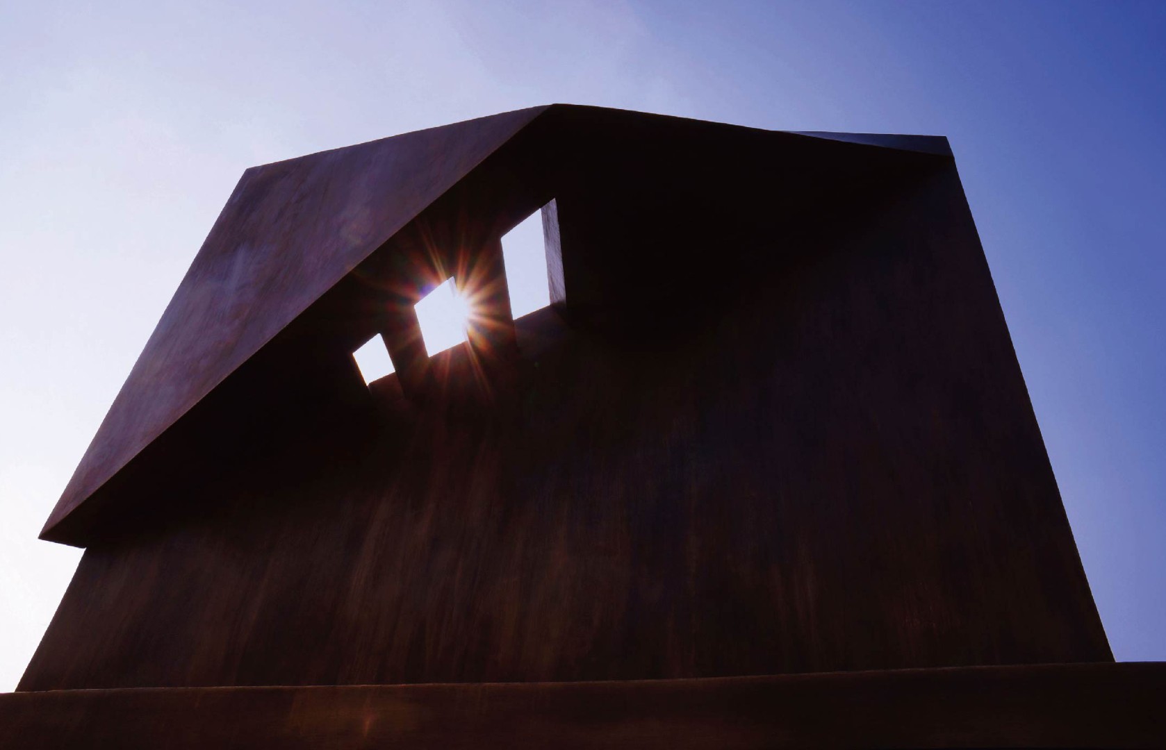 Light with sunlight passing through its openings