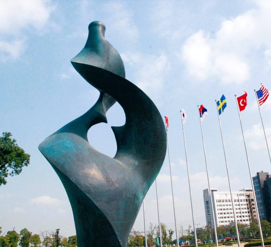 Wind Dance, an upright bronze form against the sky