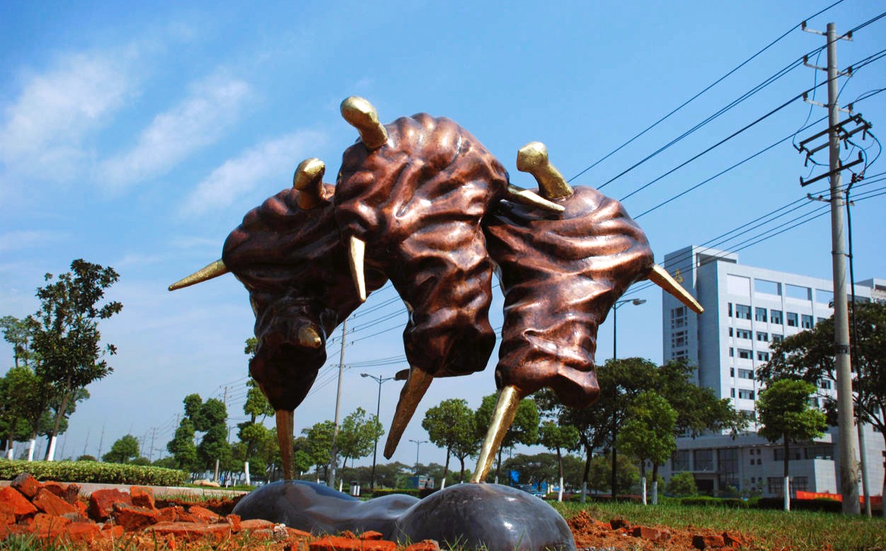 World Cup Mountain, three bronze football players in an outdoor setting