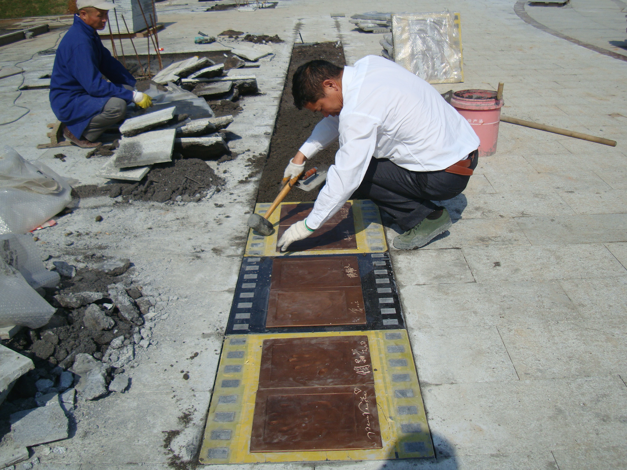 Bronze Handprints of Film Stars — Installation of the plaques