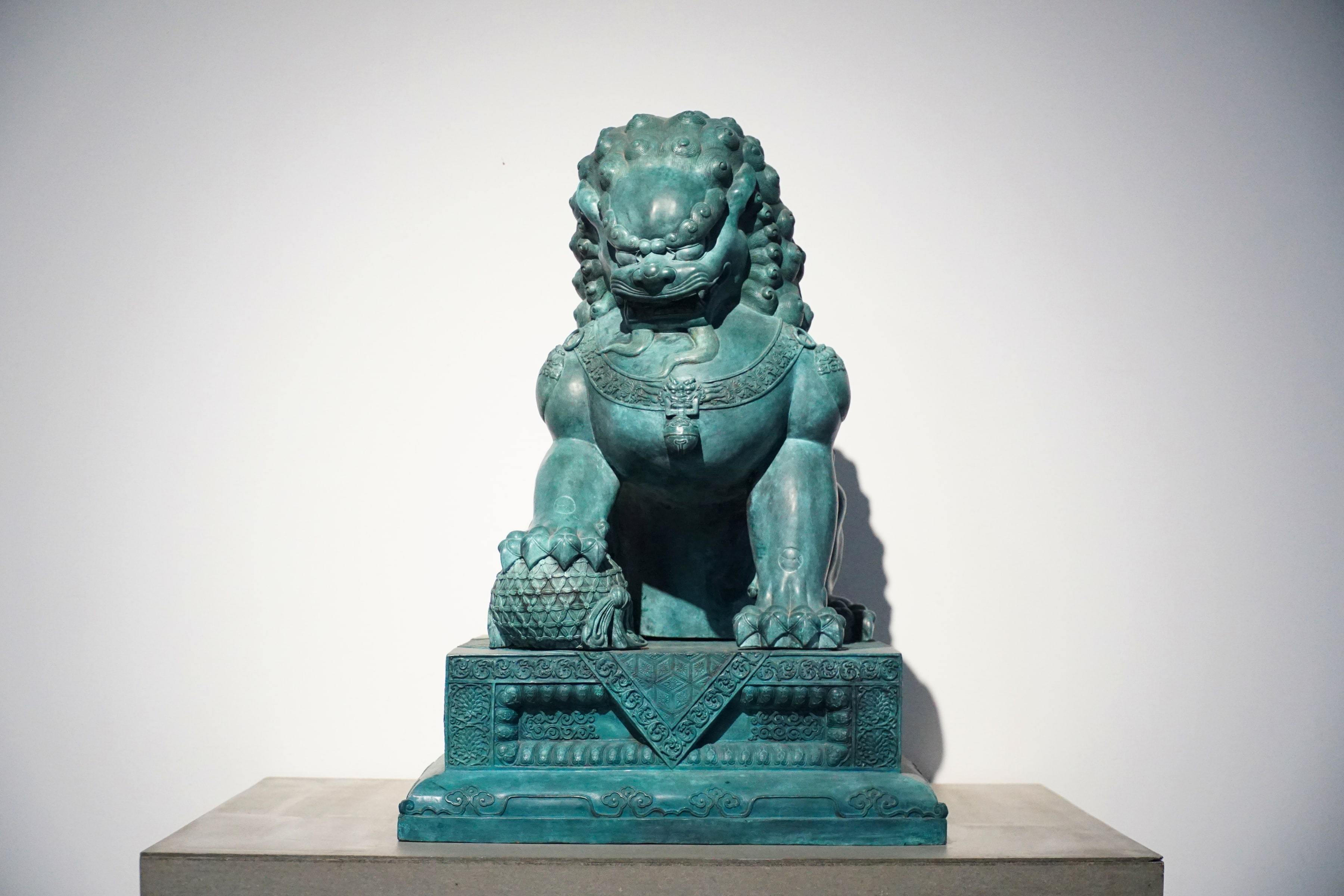 Palace Lion Pair — Guardian lion with a ball