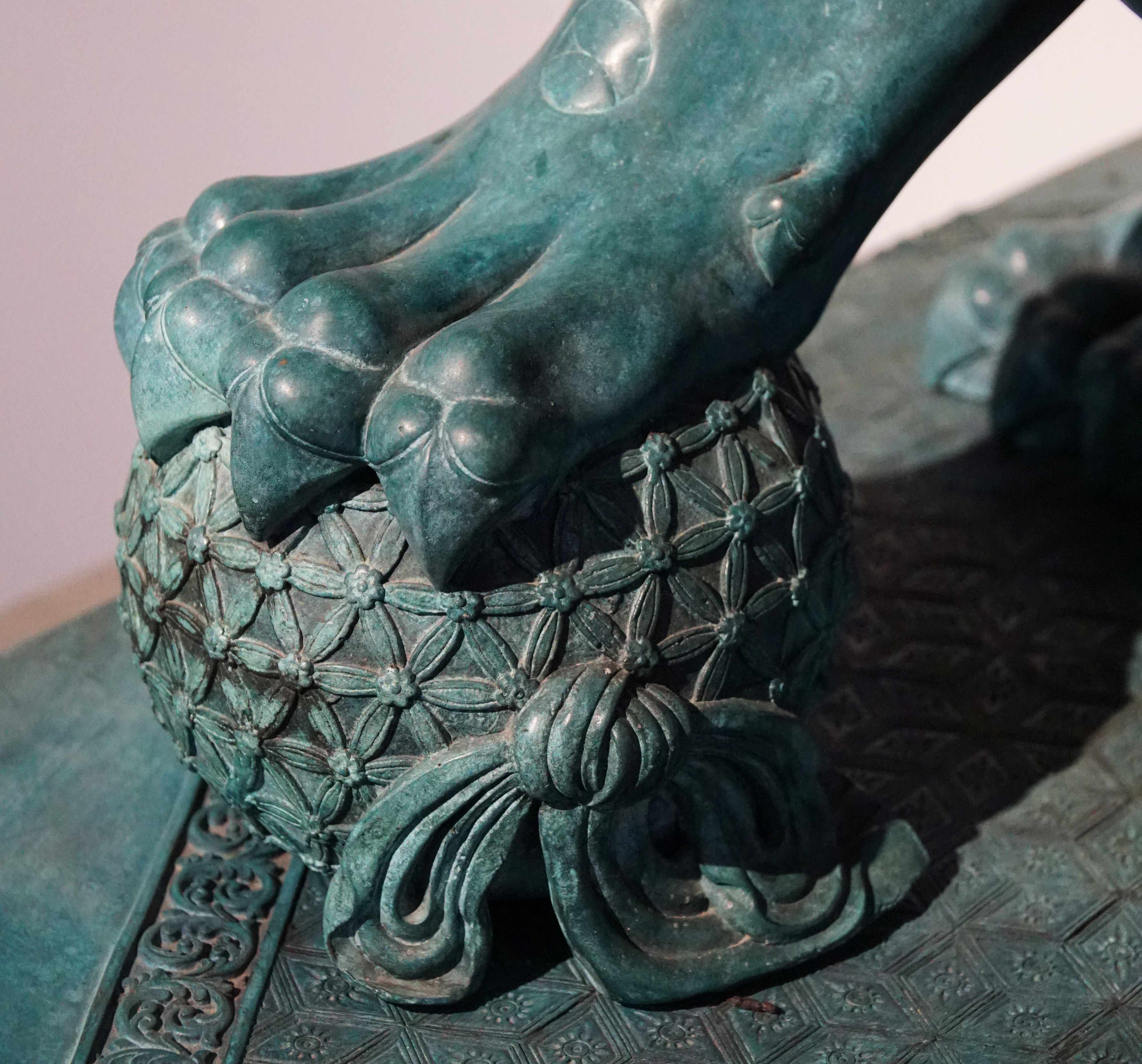 Palace Lion Pair — Paw and patterned ball