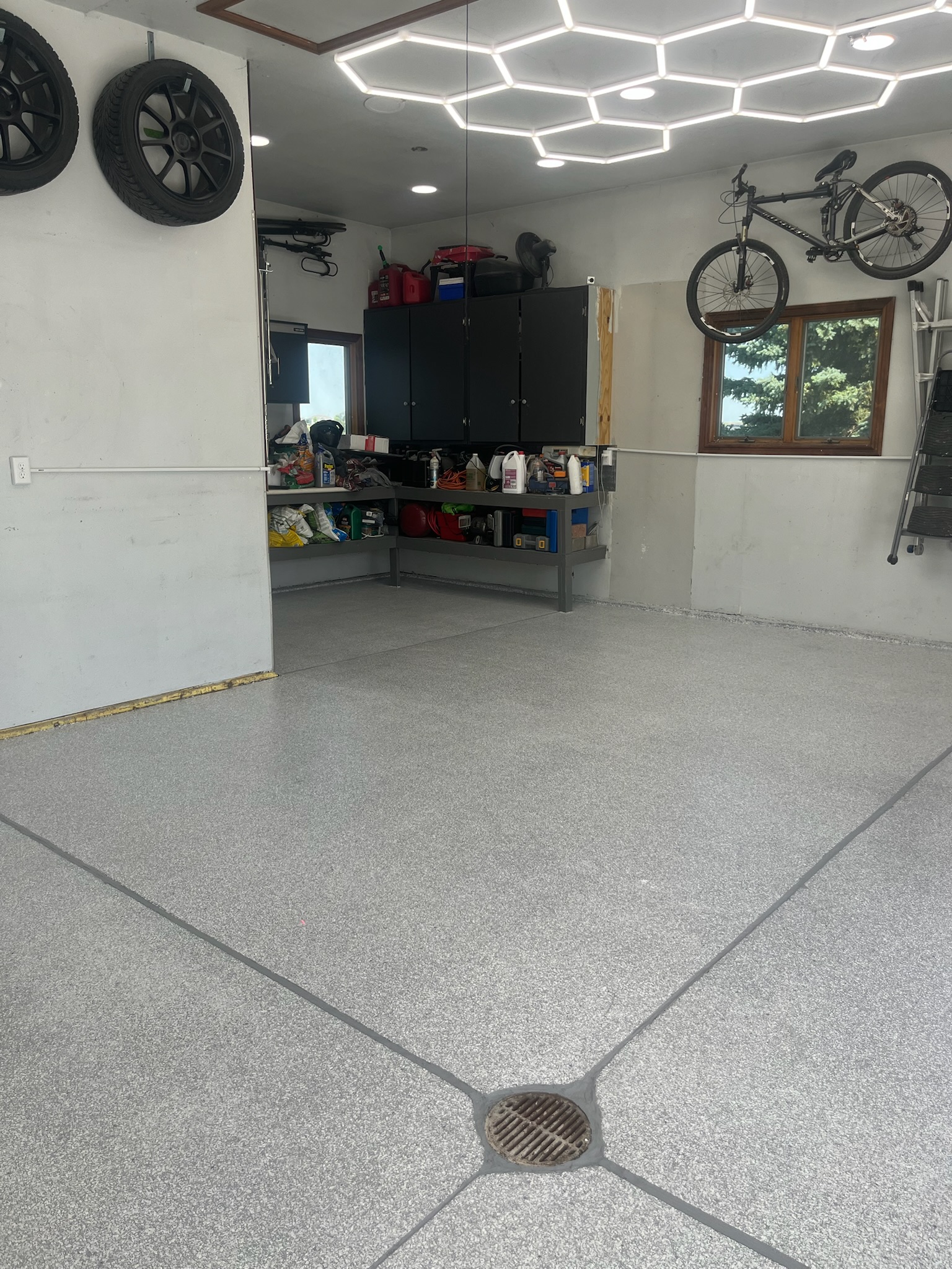 Finished gray epoxy garage floor with hexagon lighting in Bismarck, ND