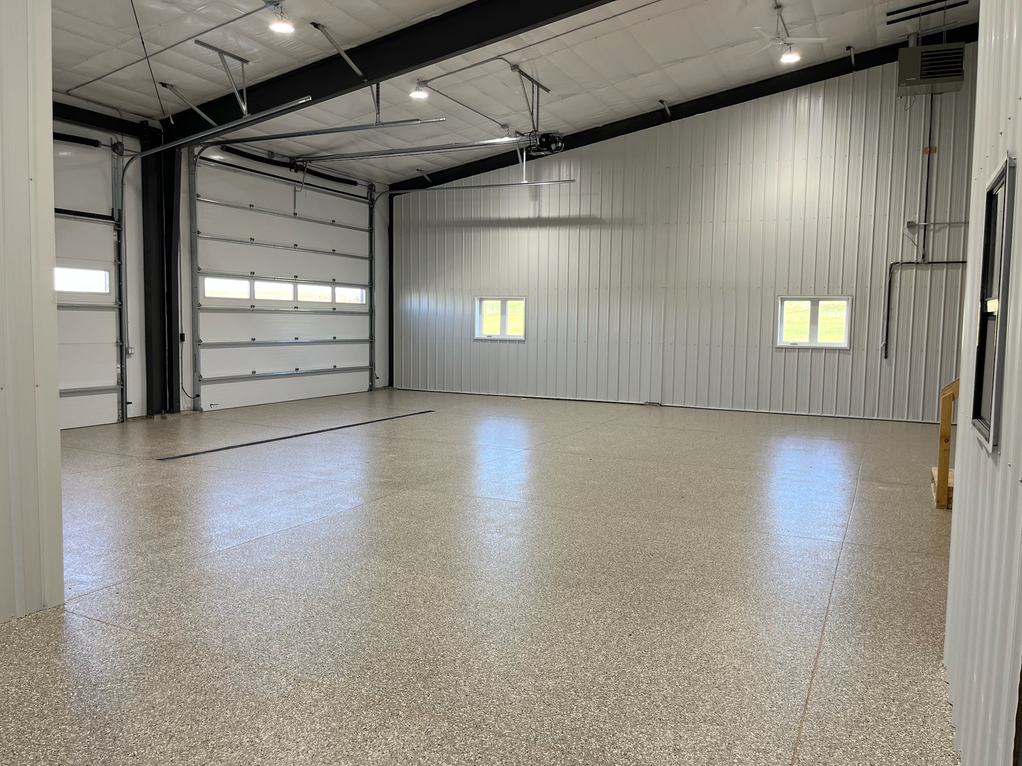 Armour Floors finished shop tan full broadcast epoxy floor coating Bismarck/Mandan surrounding area