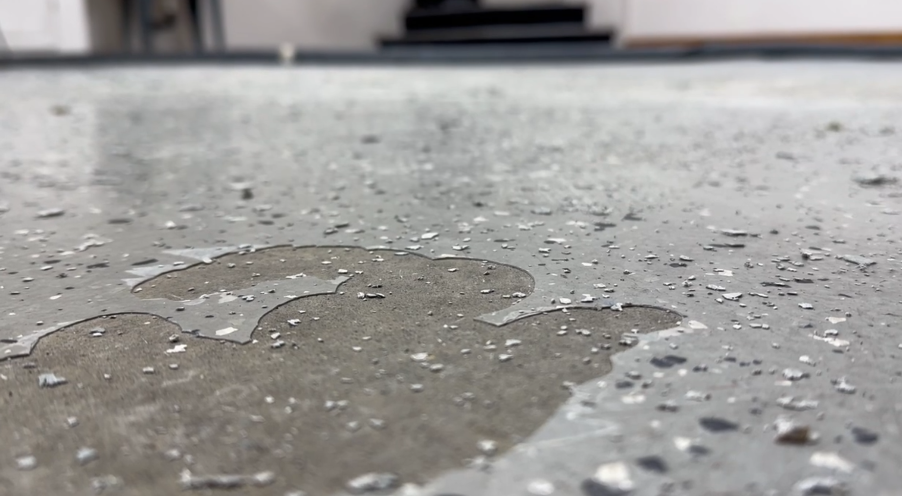 Close-up of failing epoxy floor with improper preparation and install