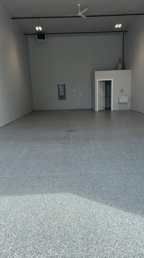 Finished shop with full broadcast epoxy floor, domino flake, in paradise valley, Bismarck, ND