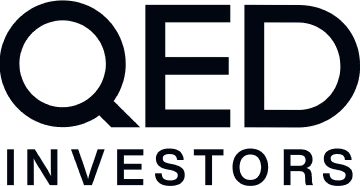QED Investors logo with bold uppercase letters.