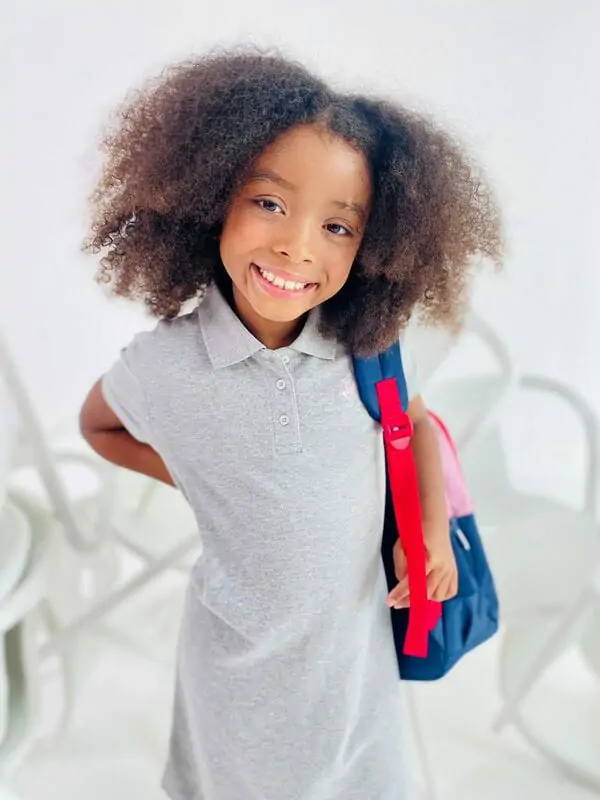 Coco-Rose modelling a pink Adidas kids' set on location
