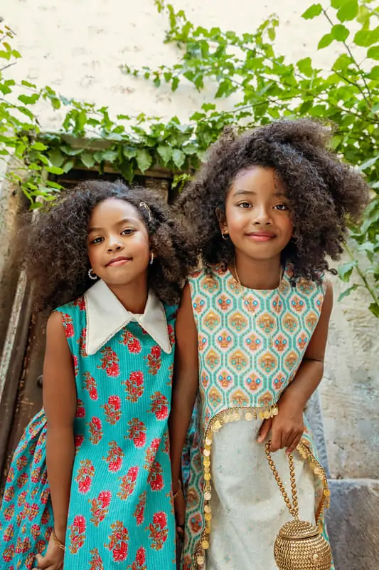 Coco-Rose and Halo in matching print dresses for a kidswear campaign