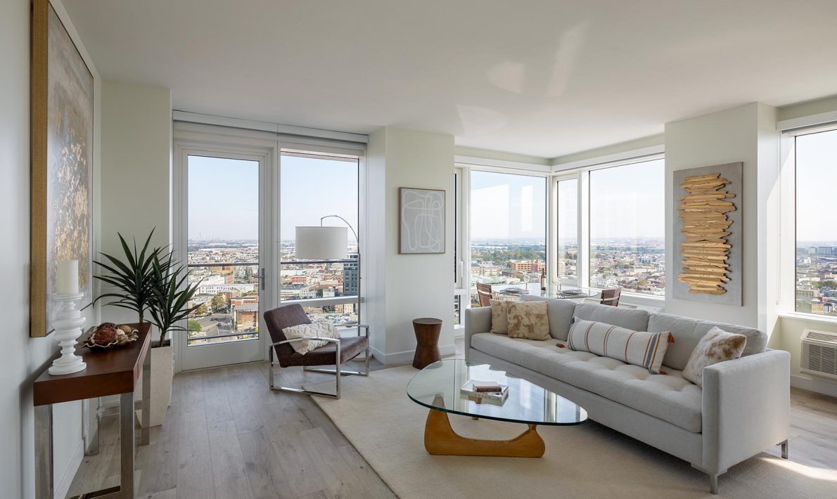 ICONIQ 777 apartment interior with oversized windows near Newark Penn Station