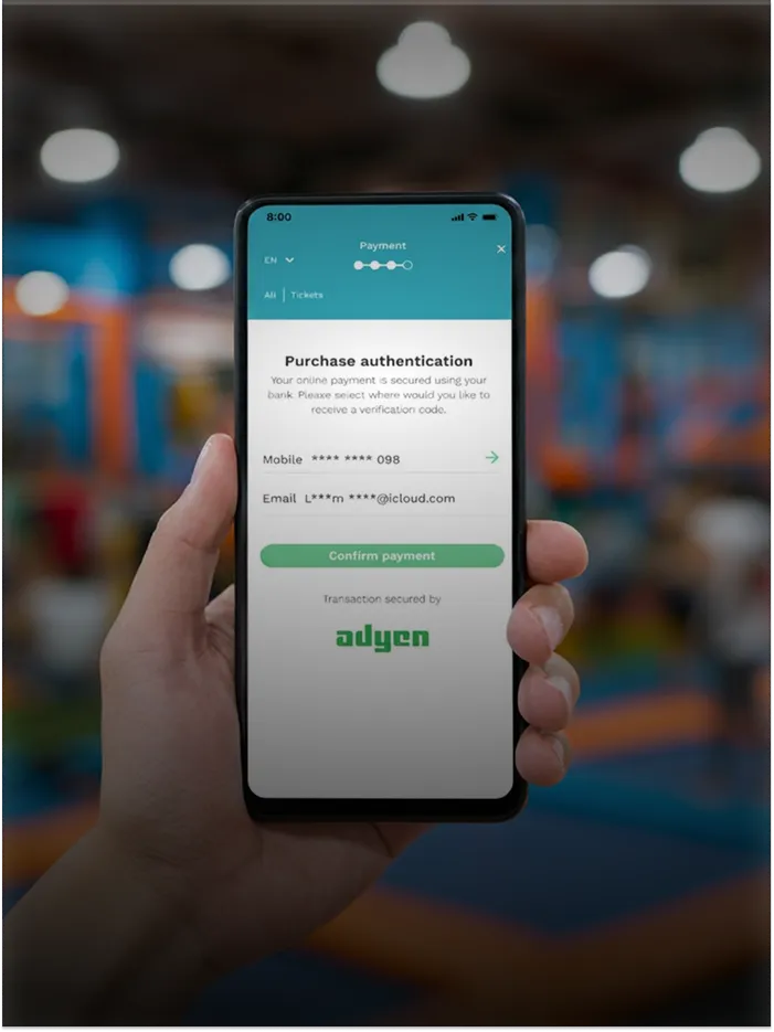 Hand holding phone showing purchase authentication with options to receive verification via mobile or email.