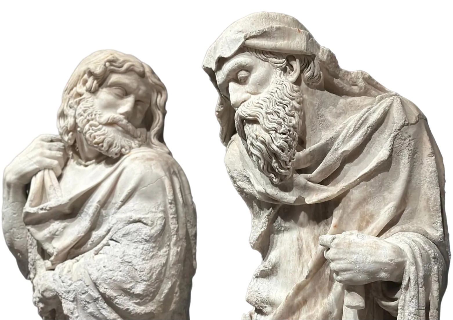Two detailed classical marble statues of bearded men in robes, one with hand on shoulder, the other holding robe.