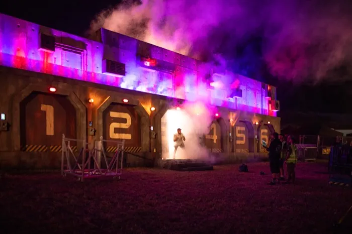 Red Bull Selector at Boomtown — numbered industrial doors in smoke