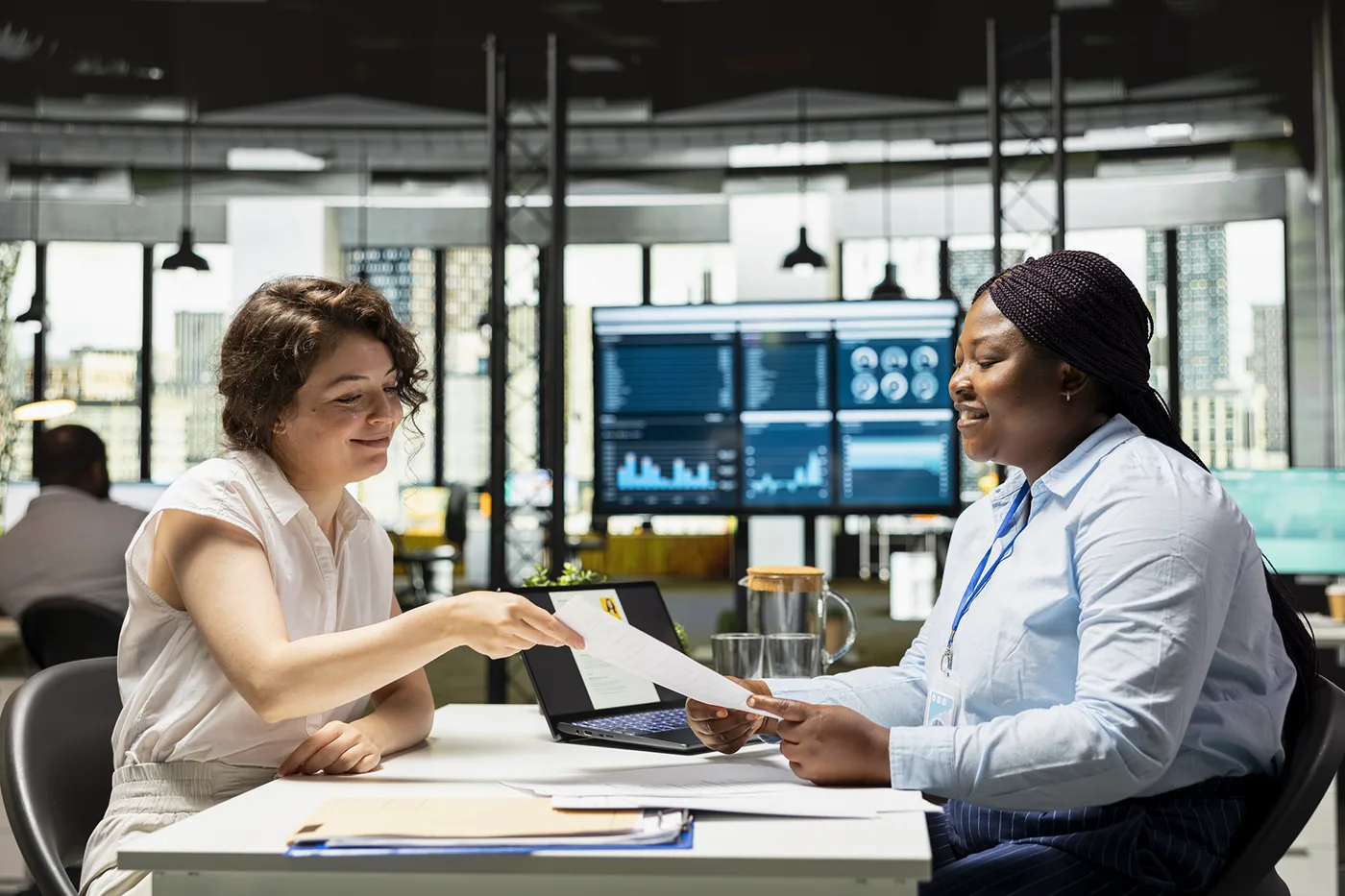 Manager and employee discussing compensation and pay decisions