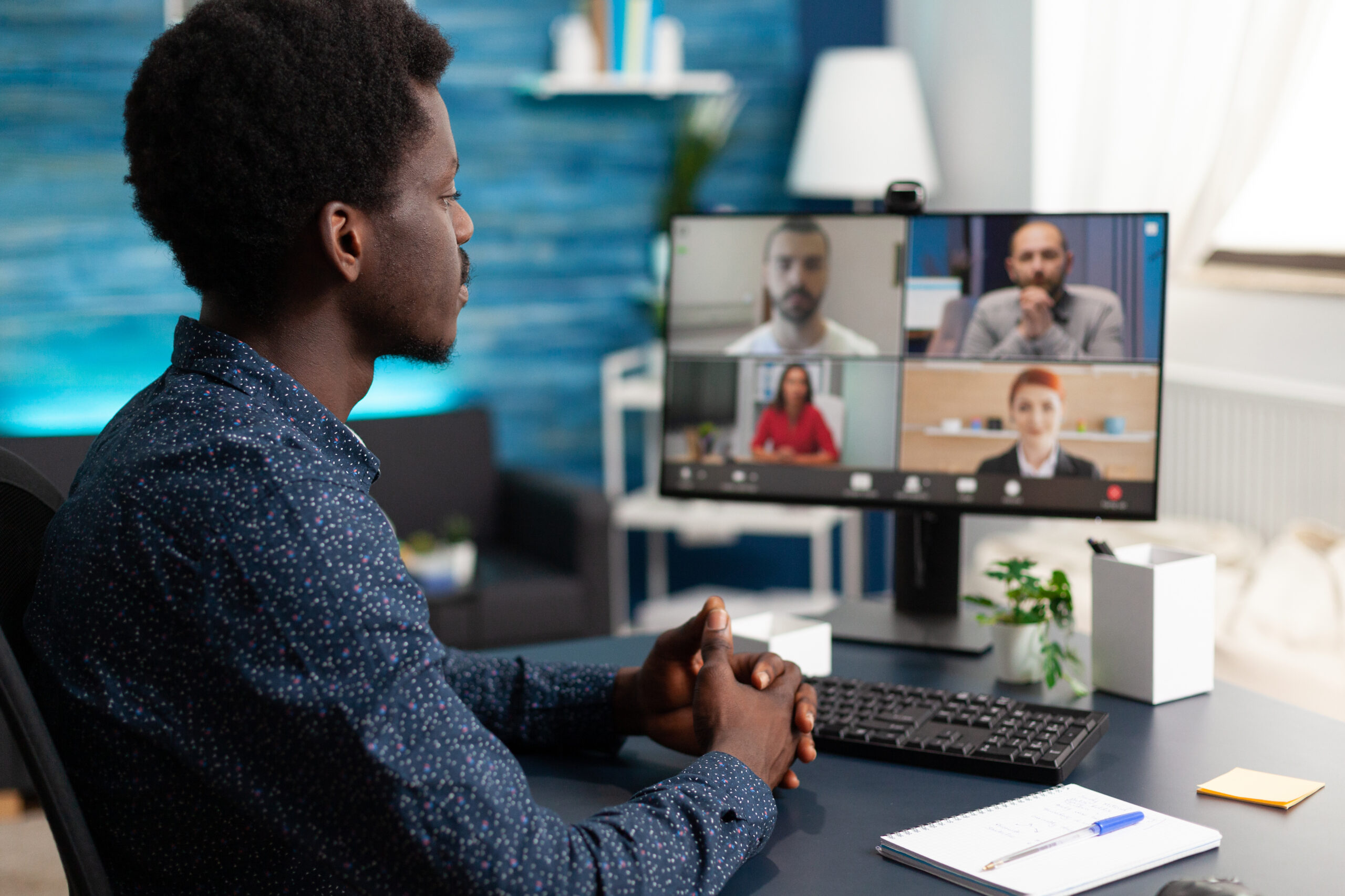Manager leading a remote employee team through digital collaboration