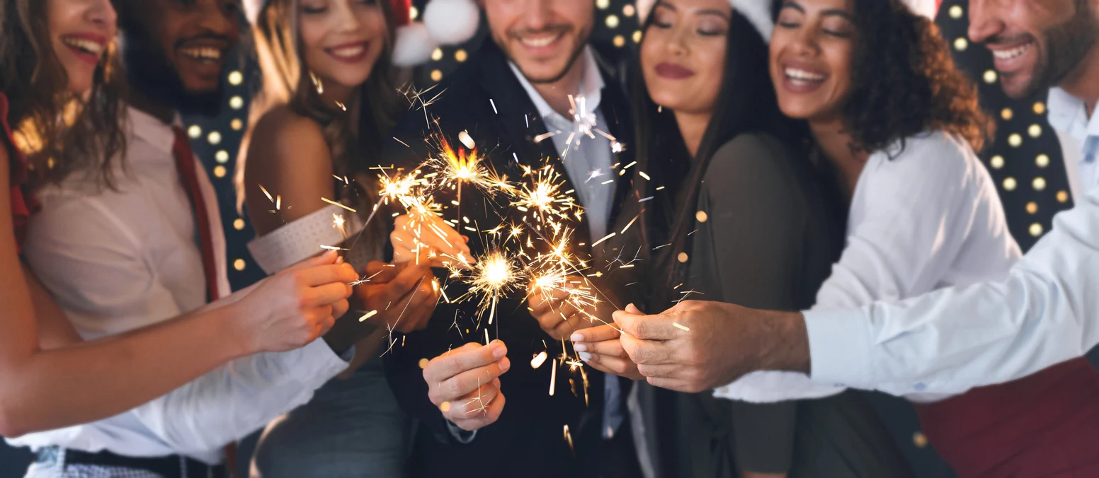 Coworkers participating in an inclusive workplace holiday celebration