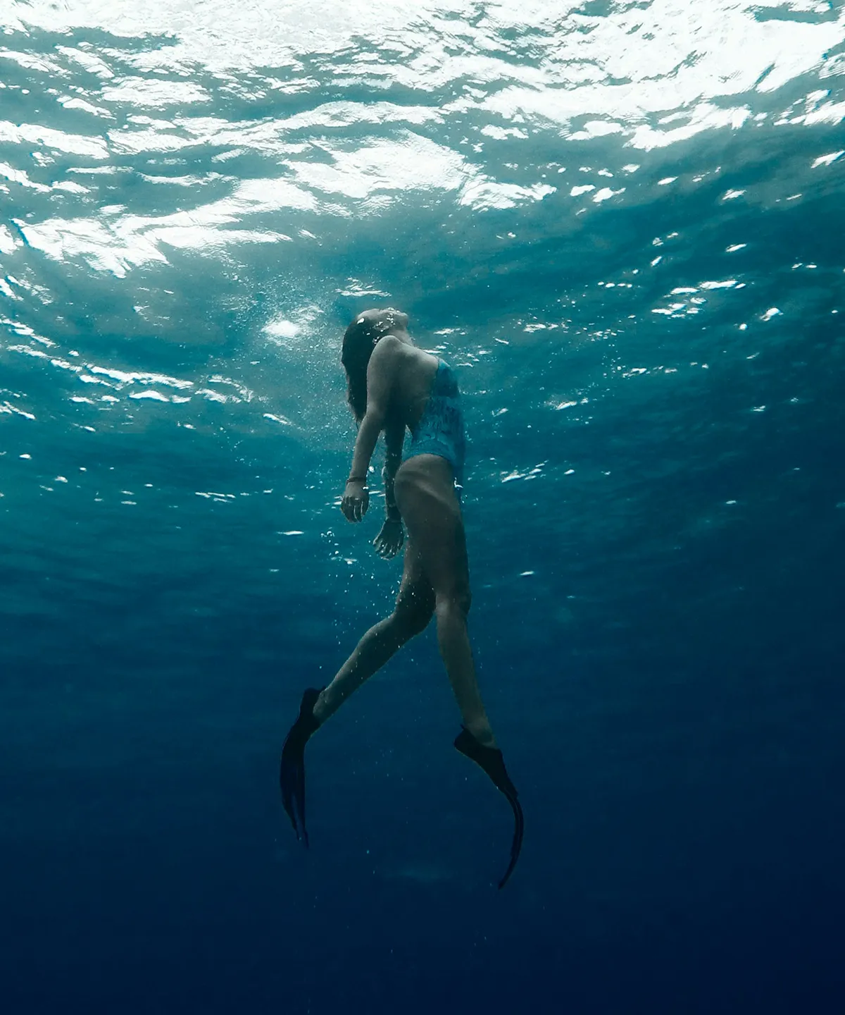 woman swimming underwater