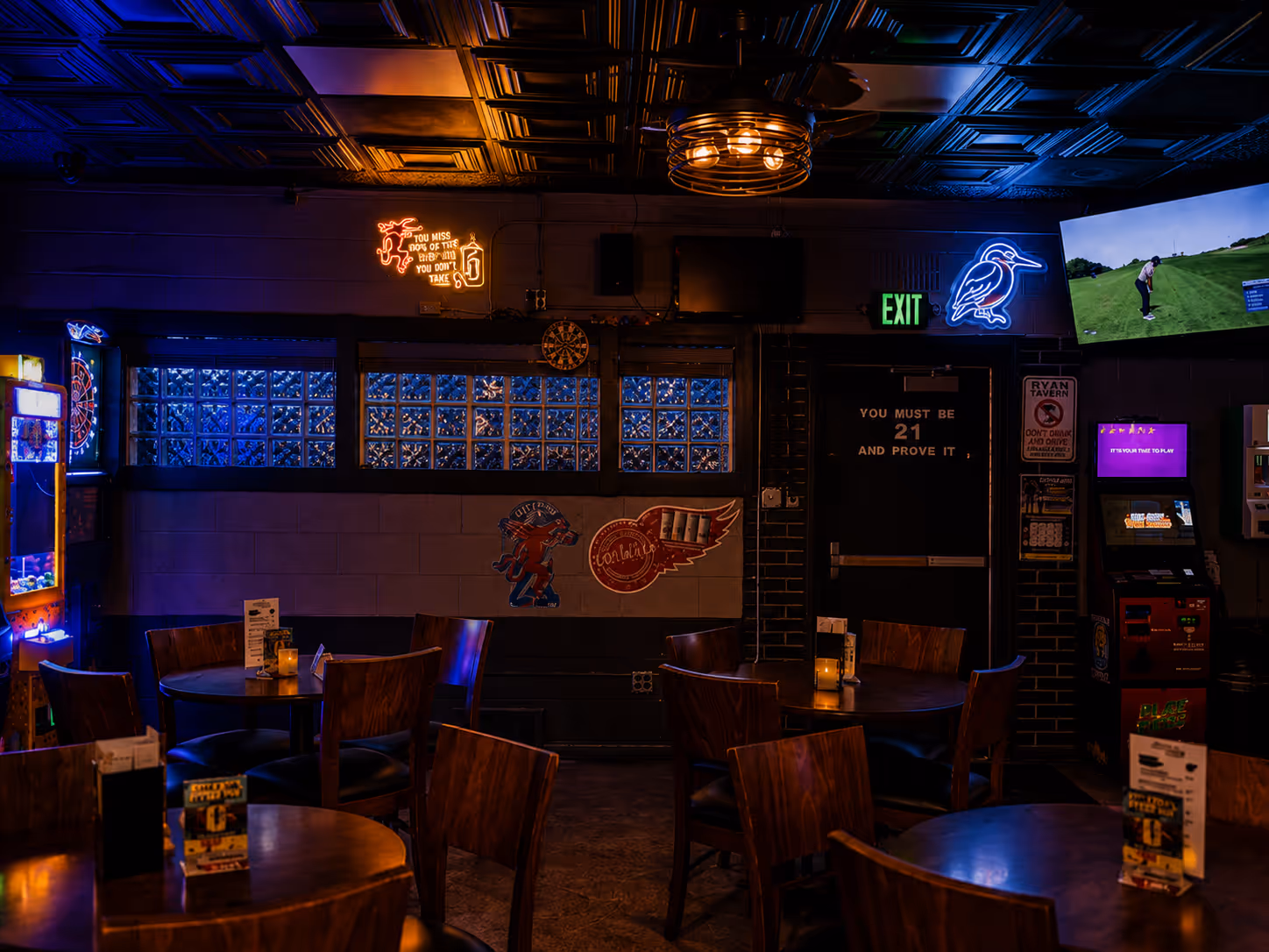 A bar with a neon sign that says exit.