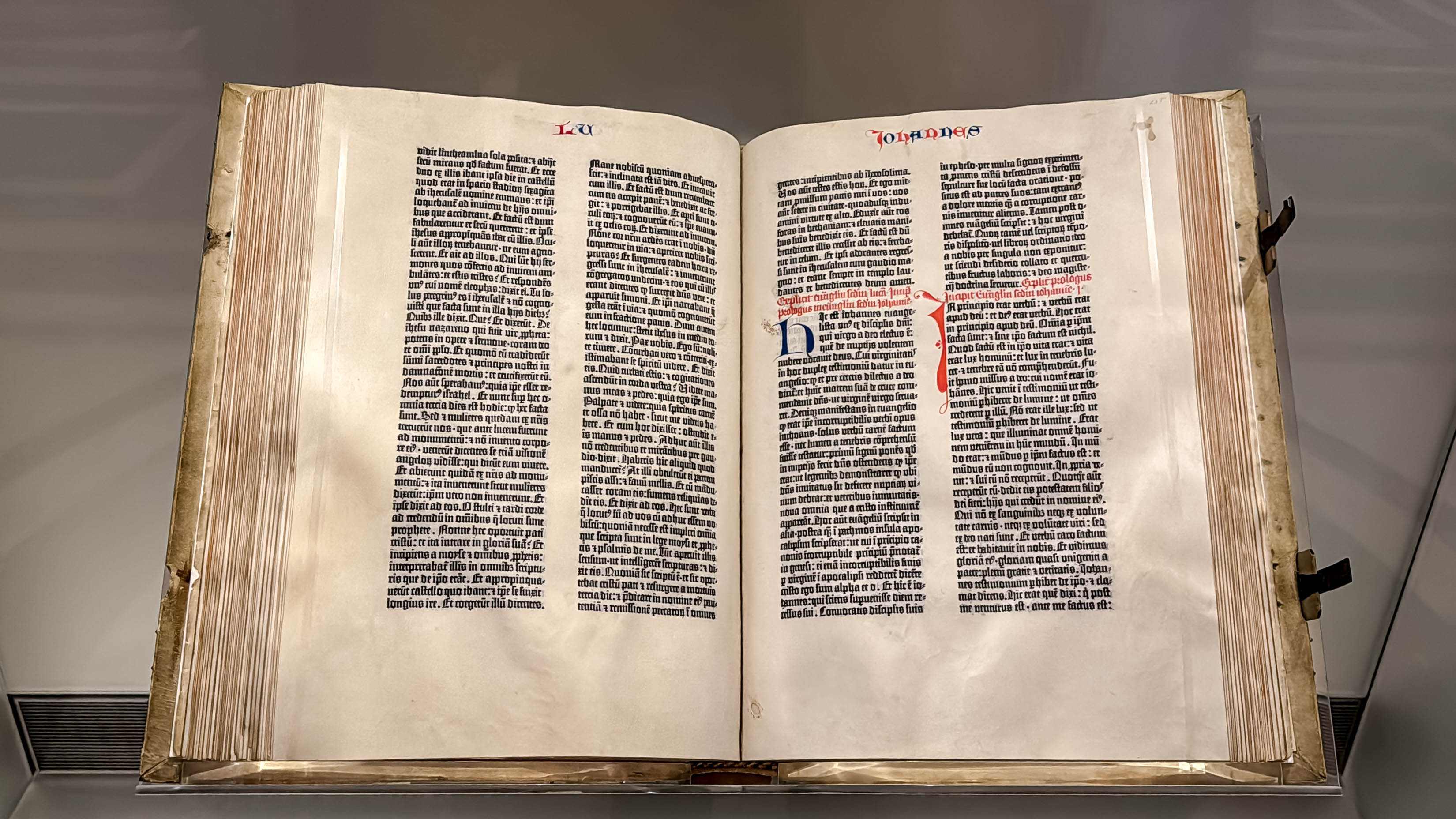 An original Gutenberg Bible, one of the first books printed with movable type, opened to the Gospel of John and displayed at the Library of Congress.