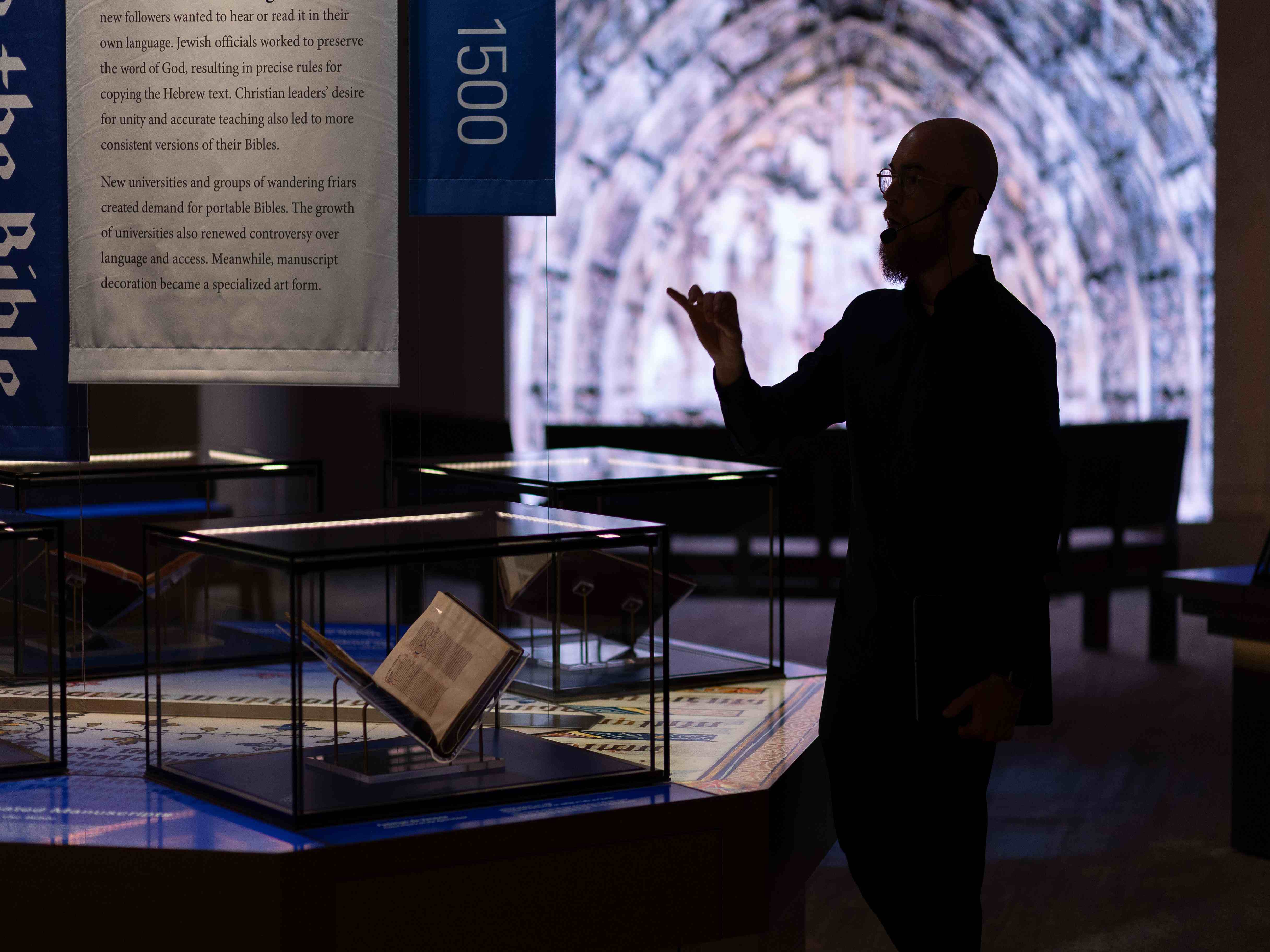Michael McAfee teaches beside historic Bible manuscripts inside the Museum of the Bible in Washington, D.C.