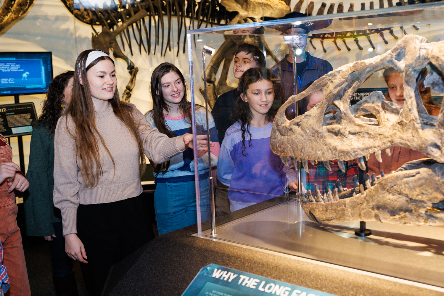 An Inspire guide introduces guests to Ebenezer, the Allosaurus skull, during a guided Creation Museum experience in Petersburg, Kentucky.