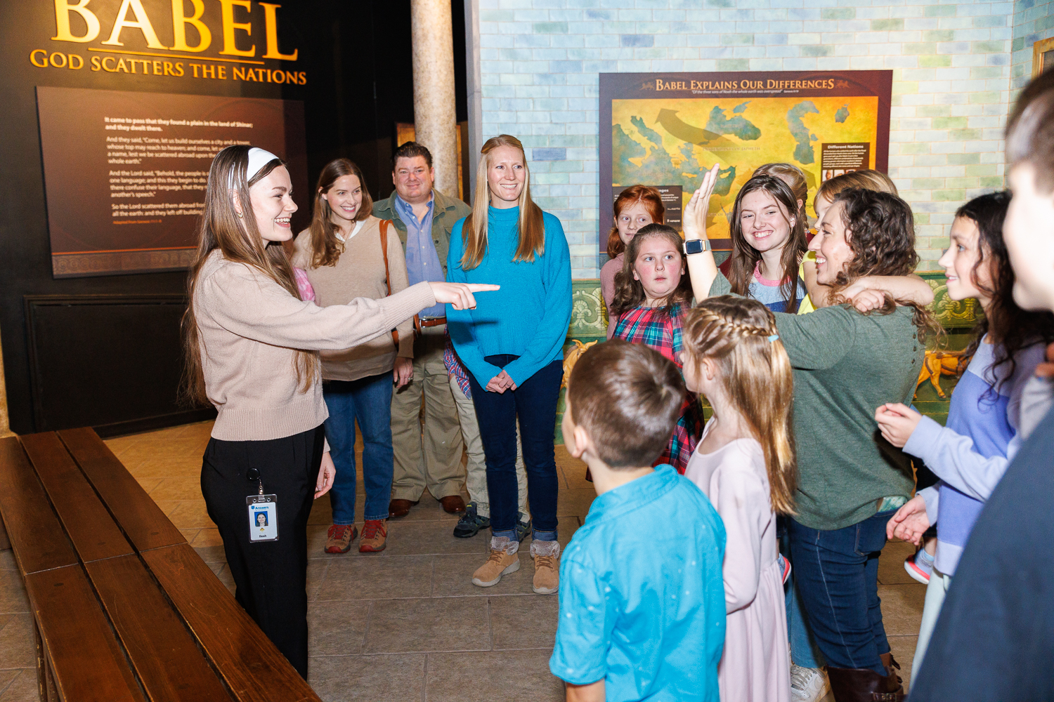 An Inspire guide engages guests in the Tower of Babel exhibit during a guided tour of the Creation Museum, explaining how the dispersion at Babel shaped the nations and languages of the world.