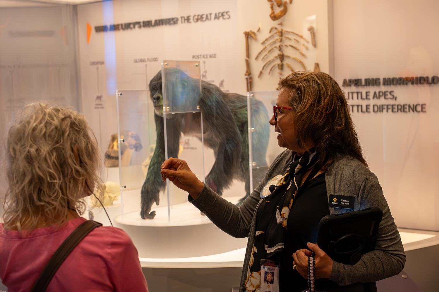 An Inspire guide explains the evidence surrounding Lucy and the apes during a guided tour of the Creation Museum's Starting Points exhibit.