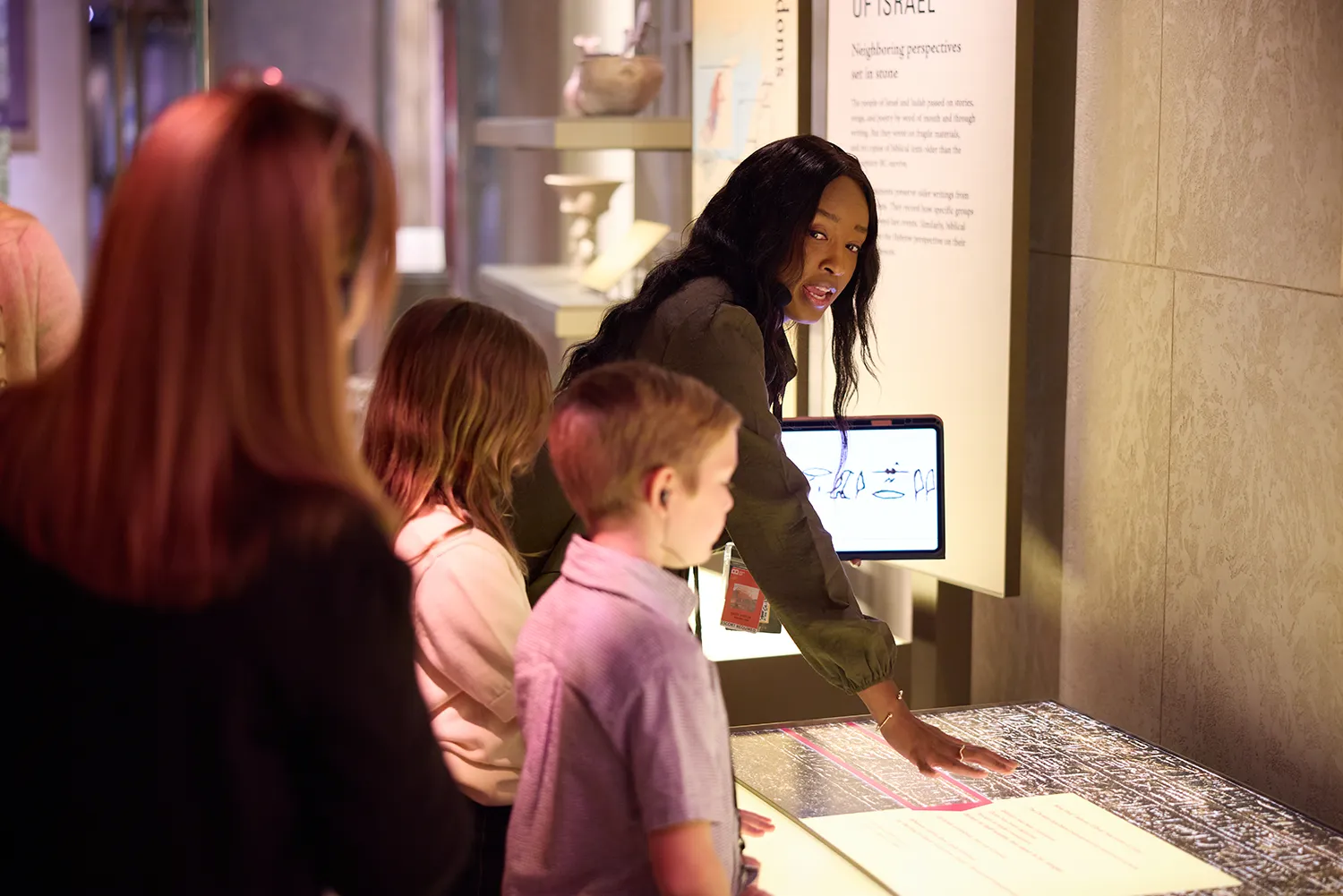 Inspire guide leads guests through an interactive exhibit at Museum of the Bible in Washington, DC.