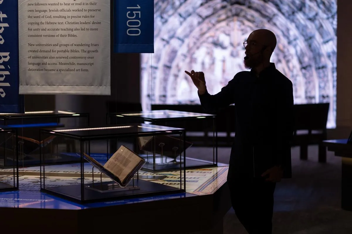 Inspire co-founder Michael McAfee teaches and guides guests through historic Bible manuscripts during a tour of Museum of the Bible in Washington, D.C.