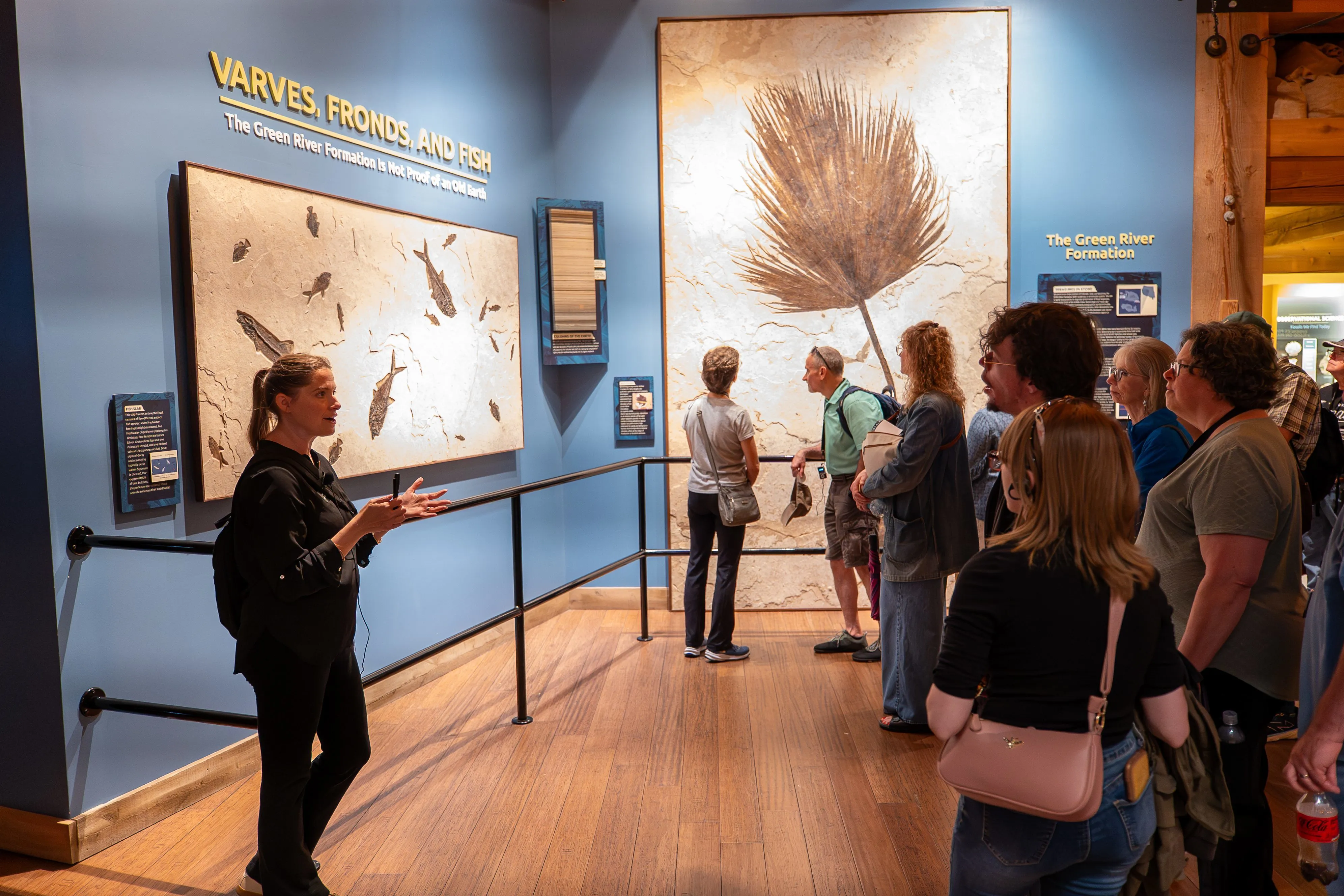 An Inspire guide teaches guests about fossils in the Green River Formation during a tour at Ark Encounter.