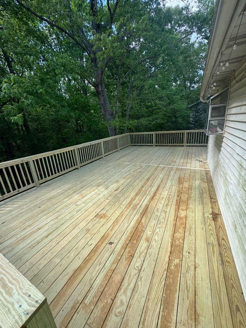 New wrap-around deck and railings on the rear of a home