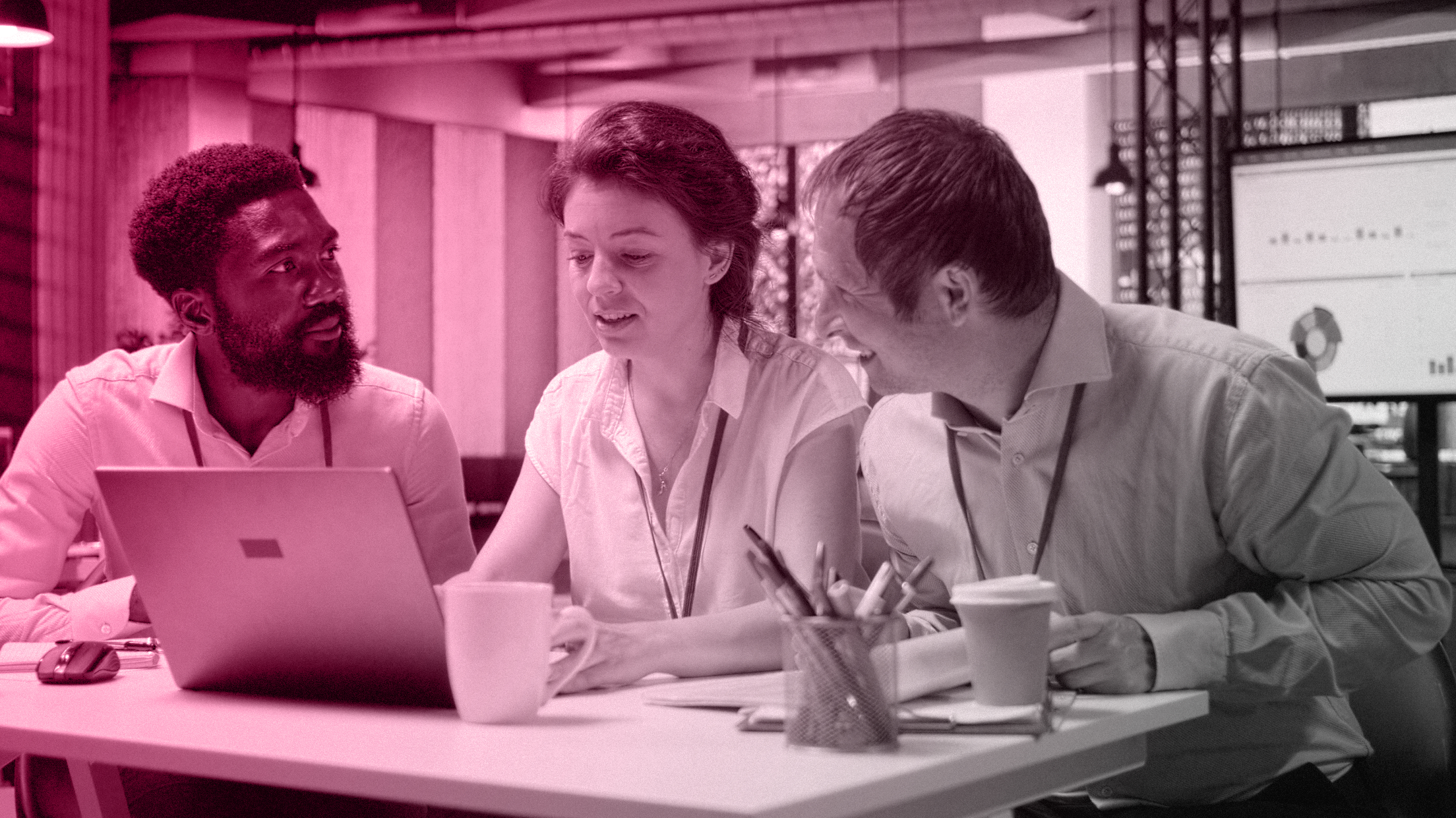 B2B LinkedIn ads strategy: marketing team reviewing a campaign on a laptop