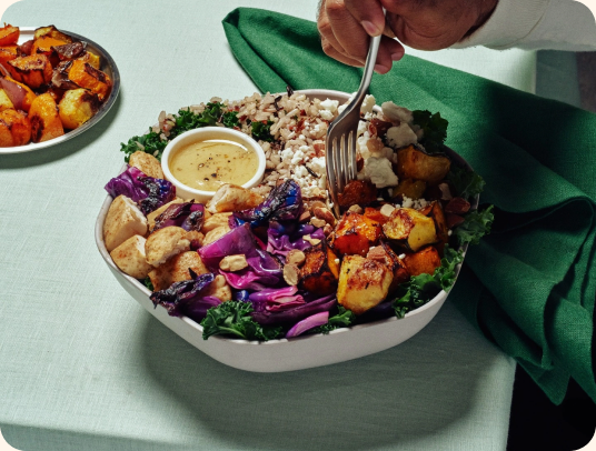 A colourful bowl of fresh food being prepared