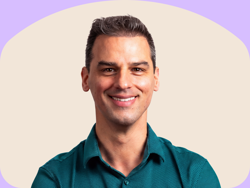 A CheqUp Clinician smiling, framed in a sand arch