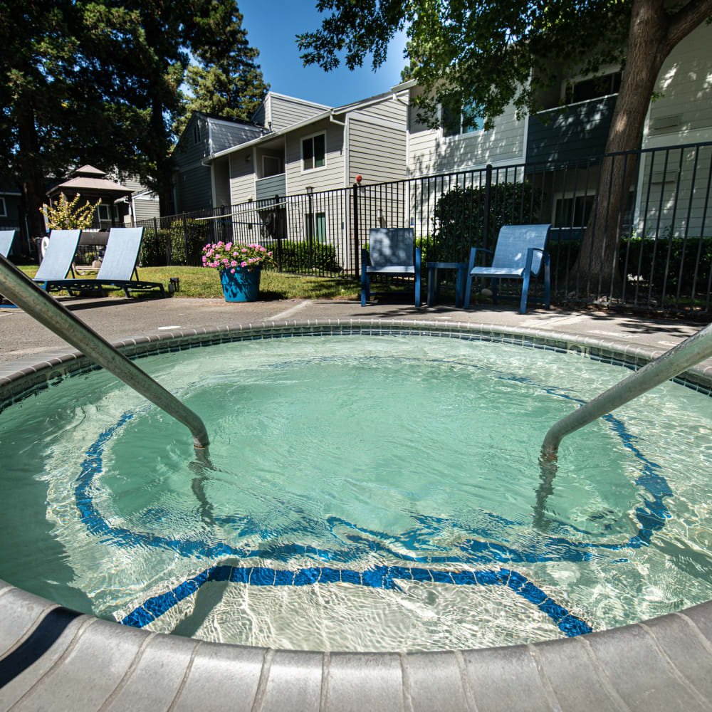 Hot tub spa with lounge chairs
