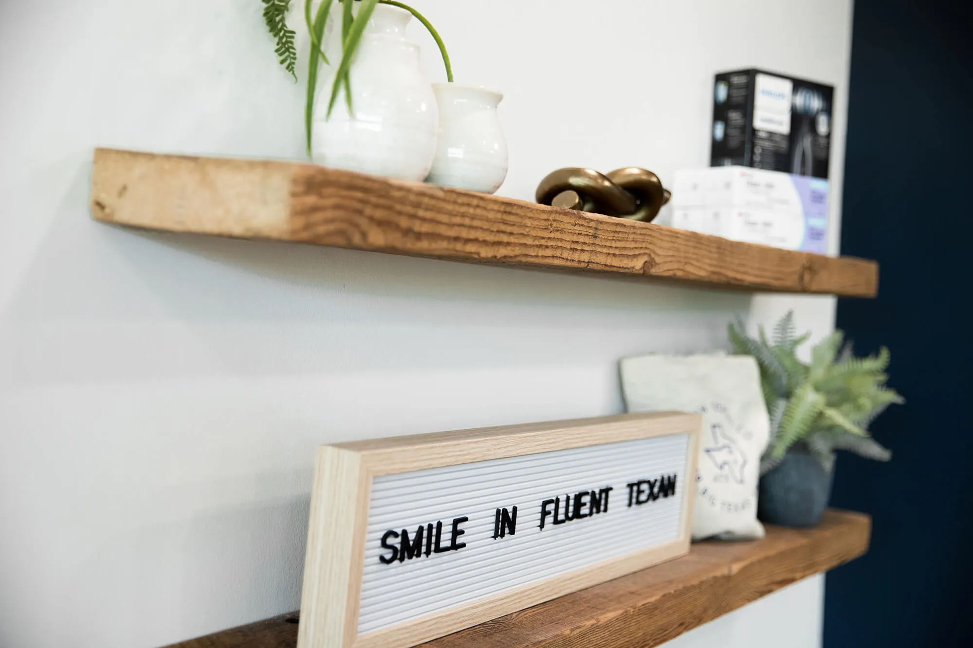 person leaning back and smiling in dental chair