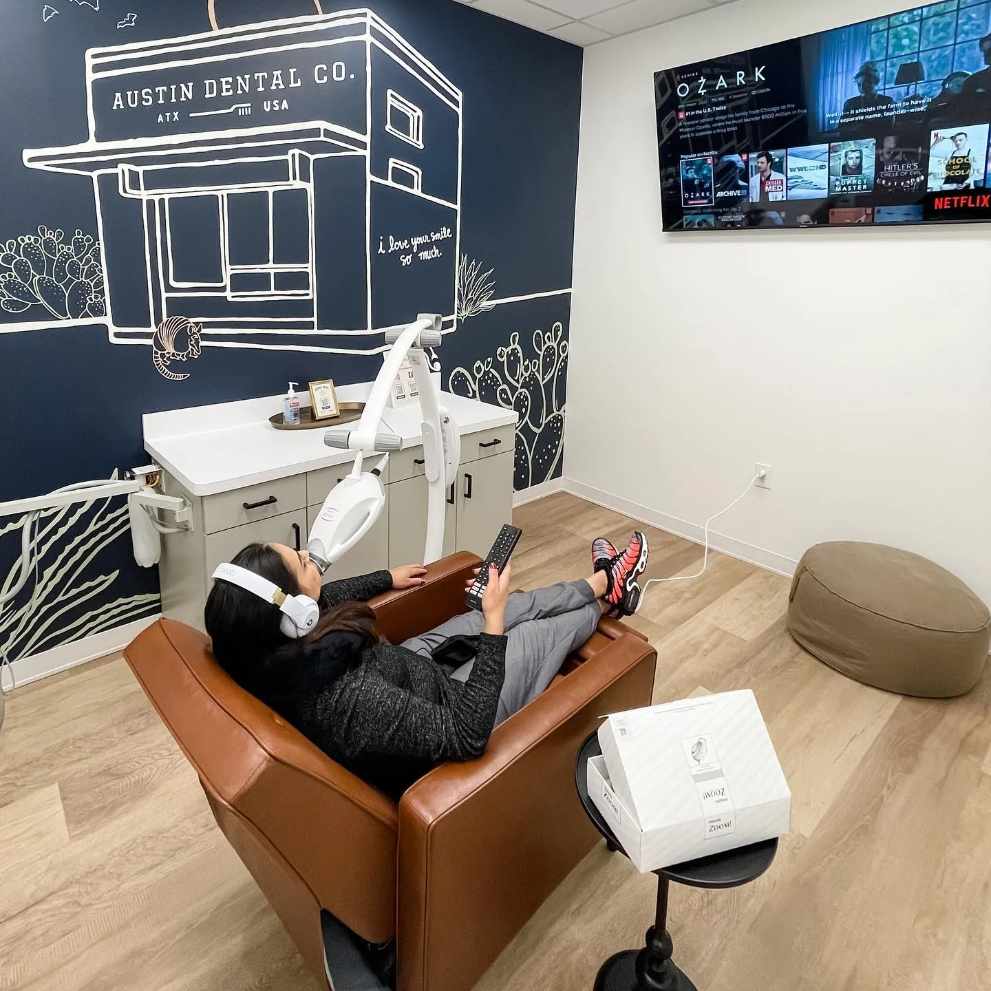 Patient sitting inside clinic of Austin Dental.