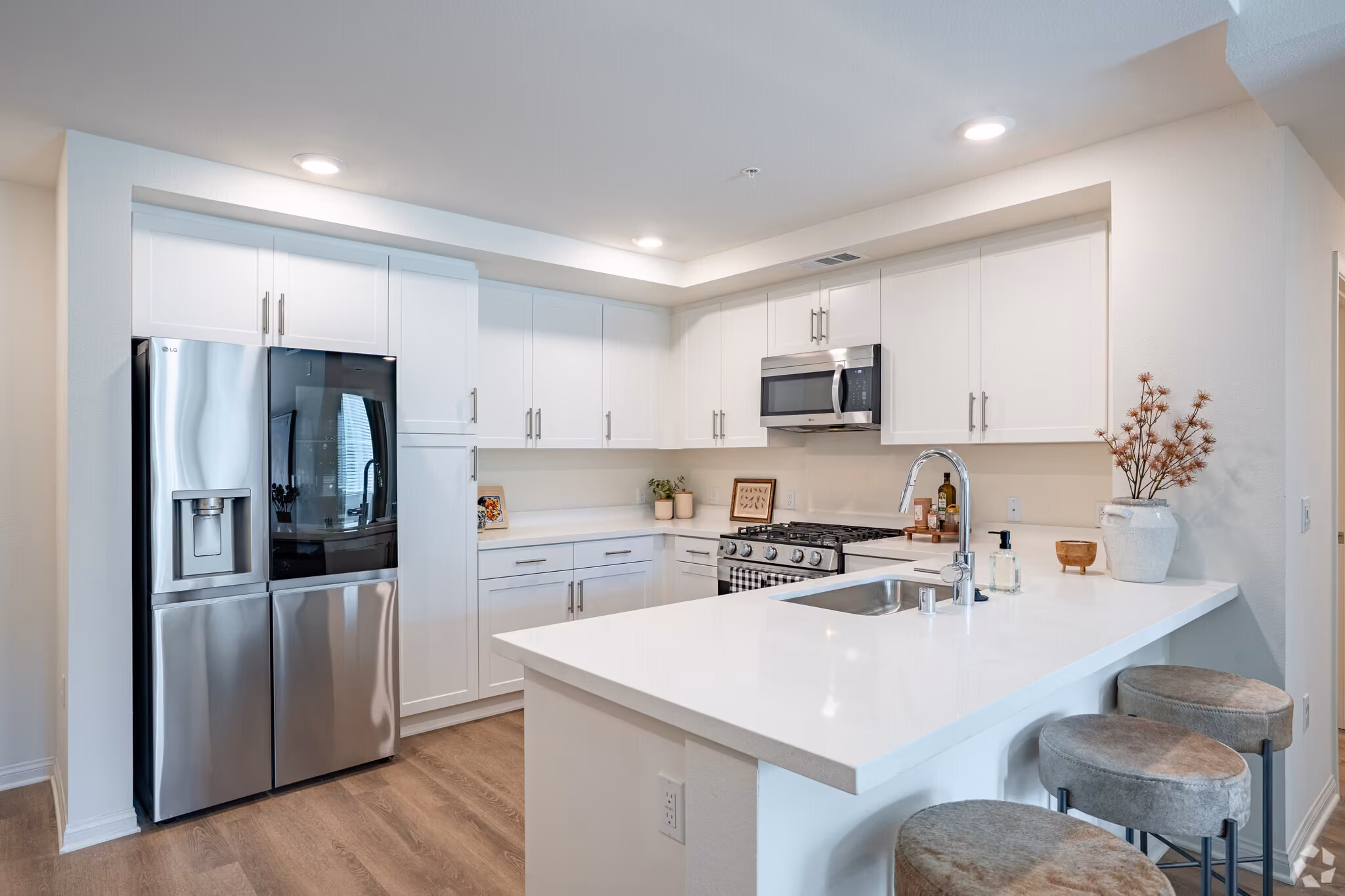 Kitchen with white cabinets and stainless steel appliances