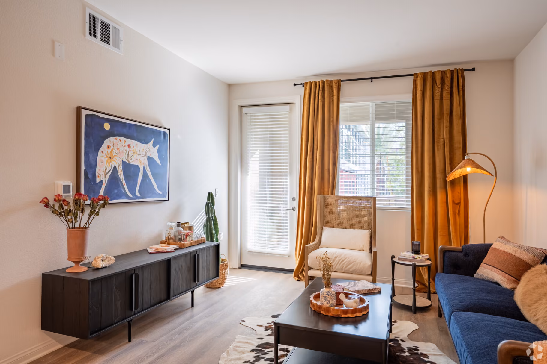 Living area with sofa, coffee table and large window