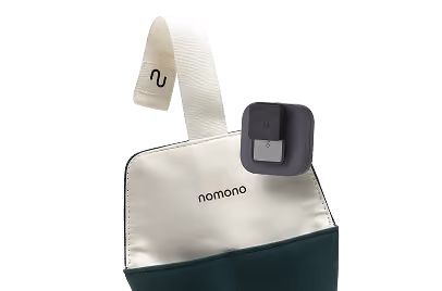 Nomono branded cream and green pouch with a Stellar Kit microphones clipped on top.