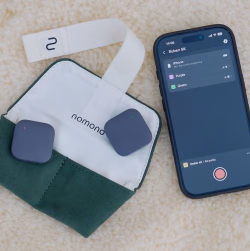 Two Nomono Stellar Kit devices beside a smartphone with app showing audio status and recording button.