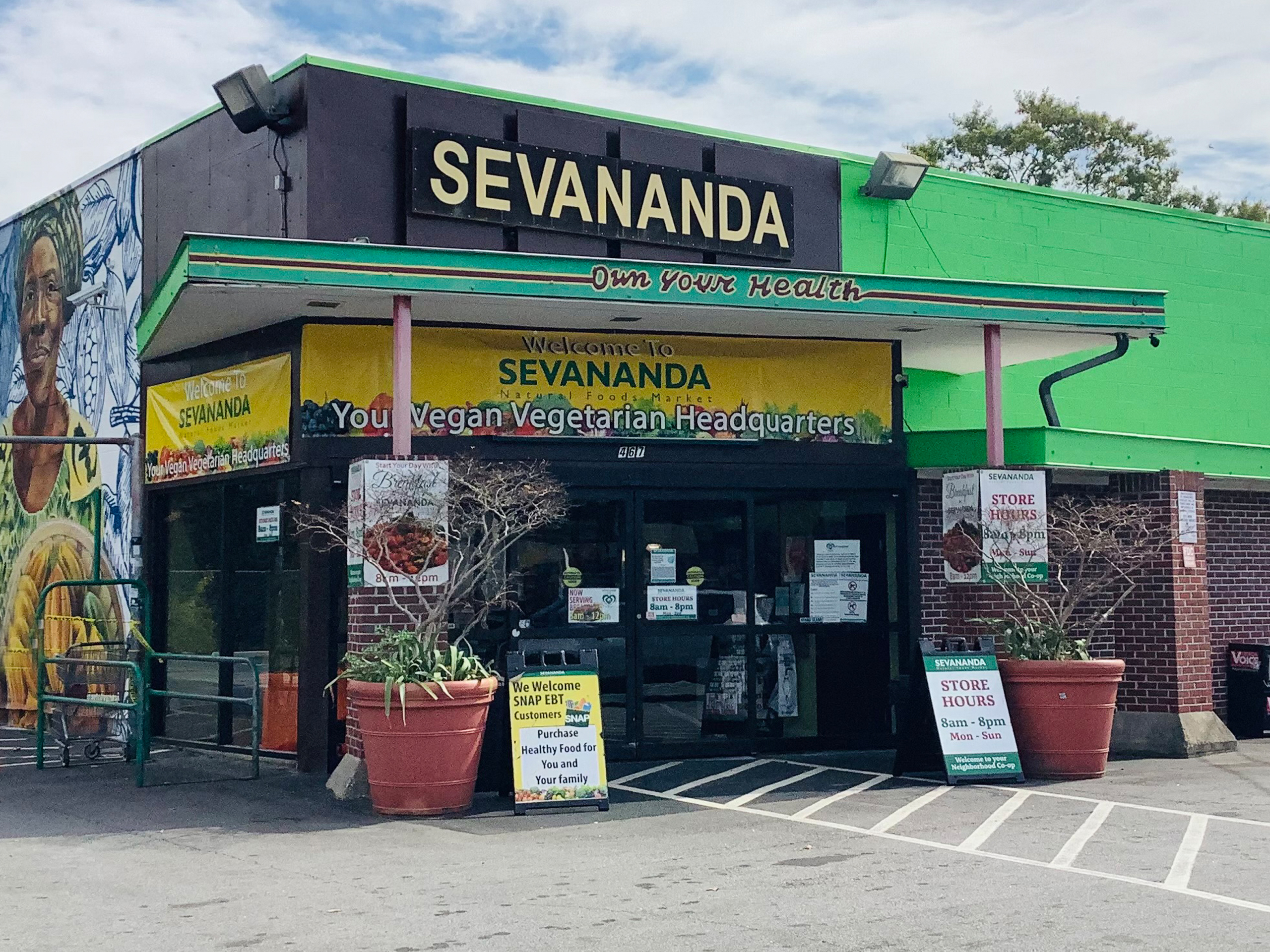 [background image] image of storefront (for a grocery store)