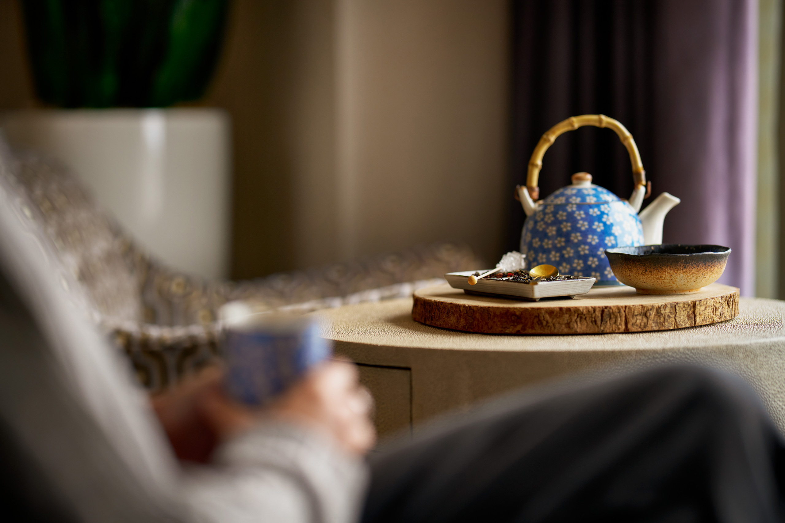 Tea set arranged on room side table.