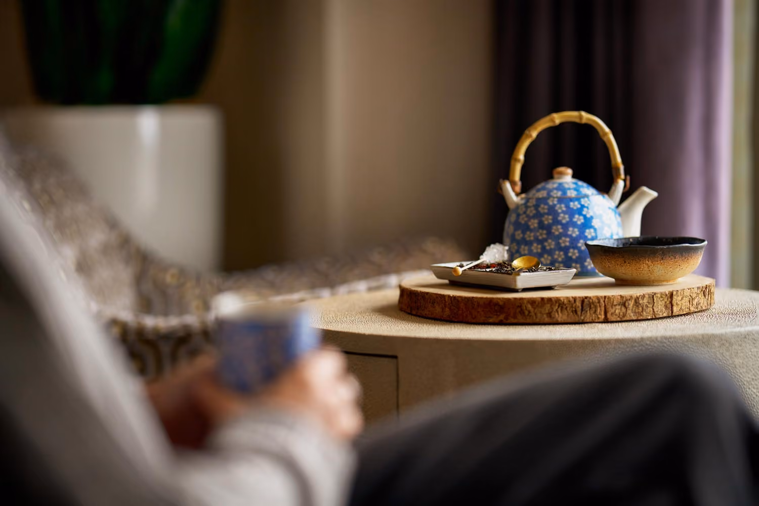 Tea set arranged on room side table.