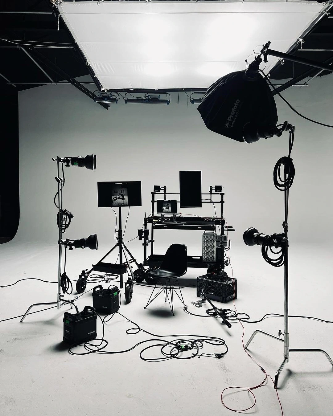 A film studio set with lights, stands and camera equipment