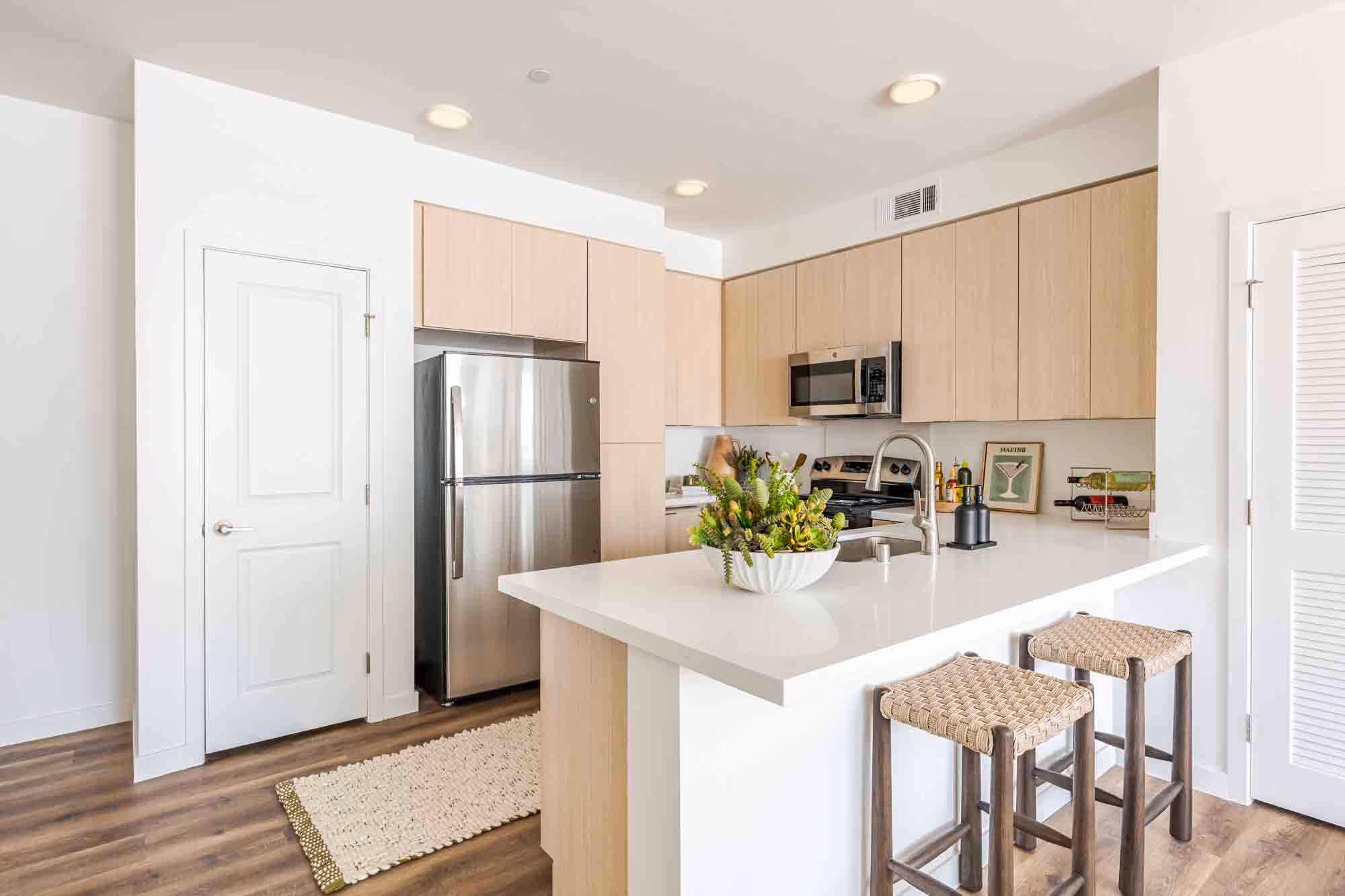Kitchen with breakfast bar and stainless steel appliances
